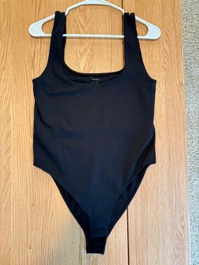 A New Day Black Seamless Bodysuit Size L Stretch Snap Closure